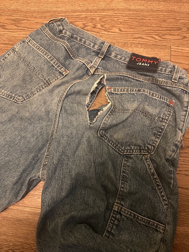 Large rip in the back of a pair of jeans