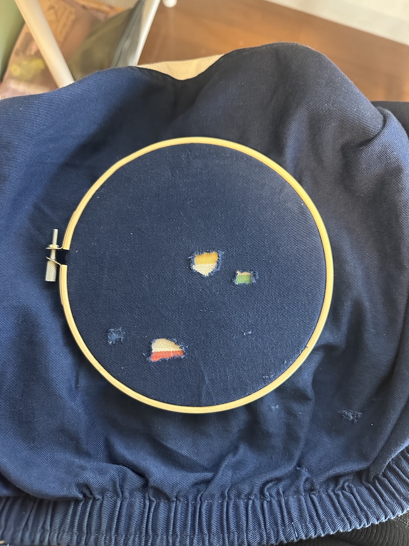 Thrifted sweater before repair