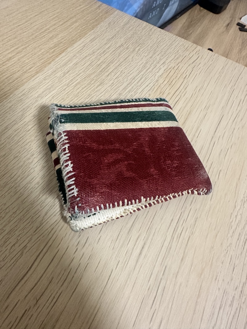 The wallet showing patina from use